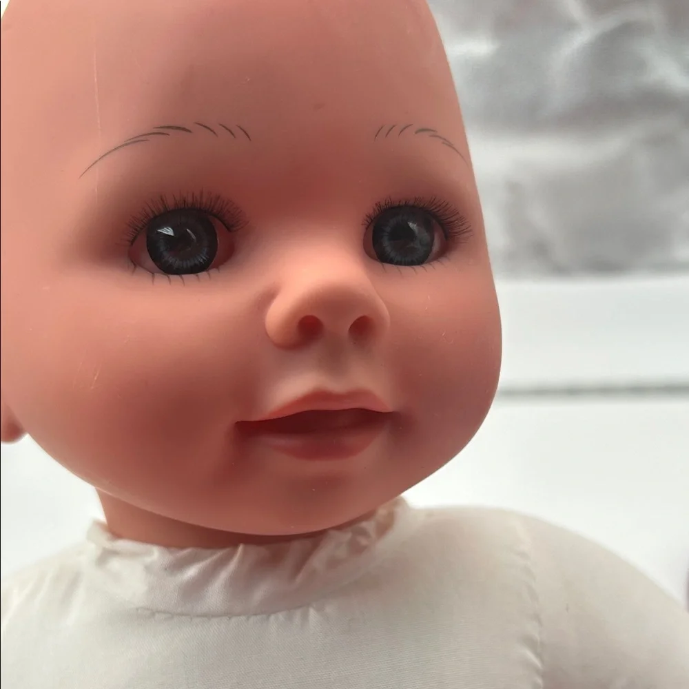 Realistic Baby Doll with White Outfit